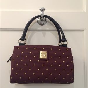 Miche burgundy handbag.