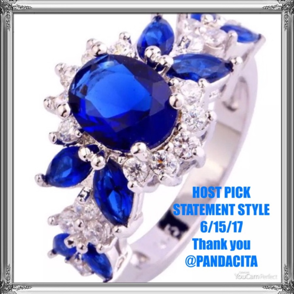 BLUE TOPAZ SET IN WHITE GOLD OVER 925 SILVER