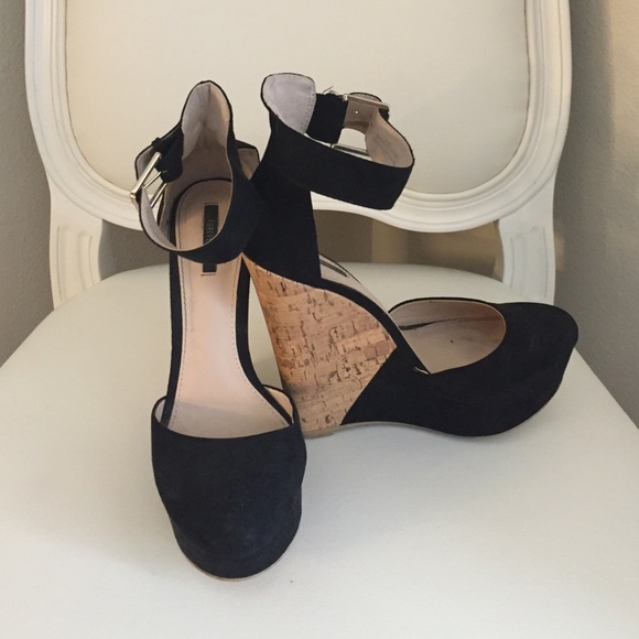 Black wedges with ankle strap.