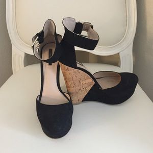 Black wedges with ankle strap.