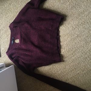 maroon sweater with details in the back