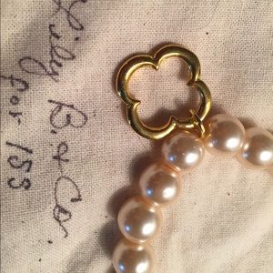 Luminescent faux pearl bracelet with gold charm