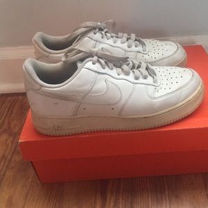 White Nike airforce sneakers.