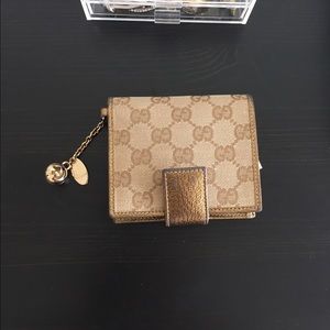 Gucci Bi-fold Gold Metallic Wallet