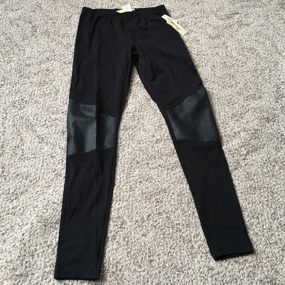 Black stretchy leggings with faux leather knees.