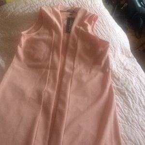 Sleeveless collarless duster