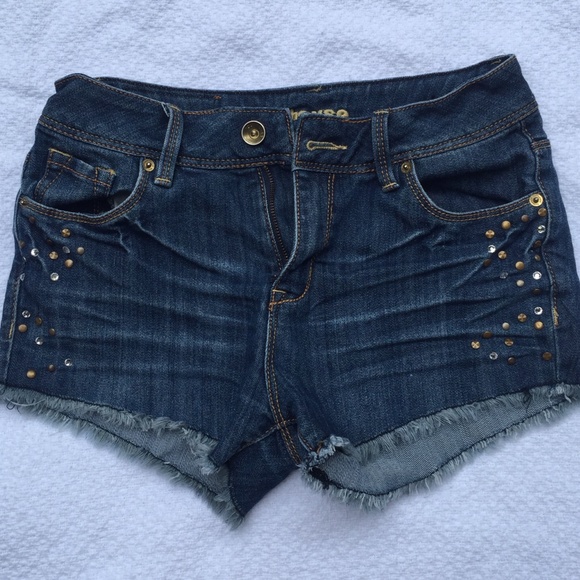 Studded denim shorts with frayed hem