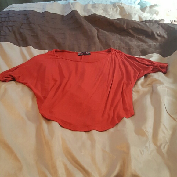 Orange cold shoulder top.