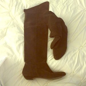 Over the knee brown suede flat boots.