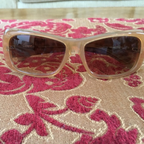 Miu Miu sunglasses with leopard print temples.