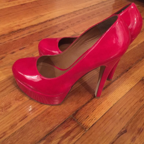 Aldo red pumps . Worn once . Looks brand new