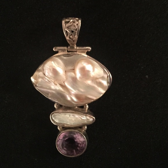 Pendant stamped .925 Silver.  Top