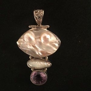 Pendant stamped .925 Silver.  Top