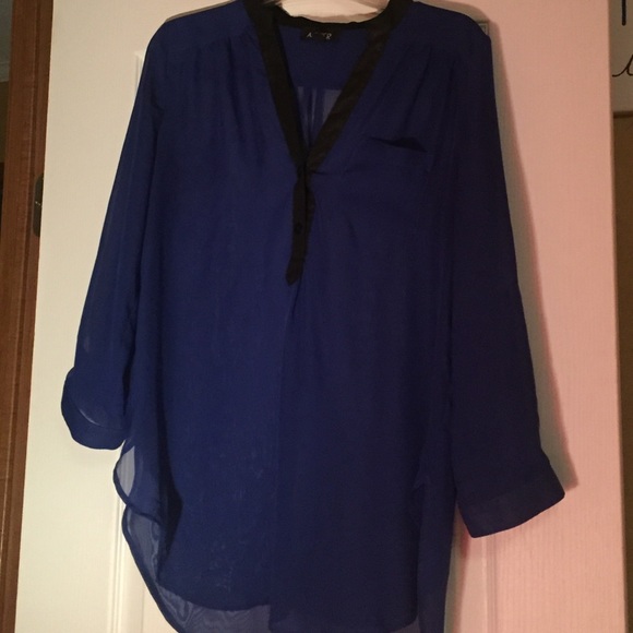 A see through blue and black shirt