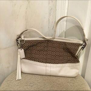 Brown and white coach purse