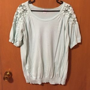 Short sleeve sweater with lace accents on shoulder
