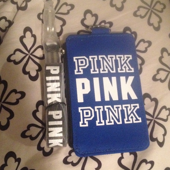 Pink coin pouch with id holder and a pink lanyard.