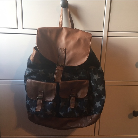 Dark blue bag with stars and leather straps