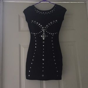 A black dress with metallic details.