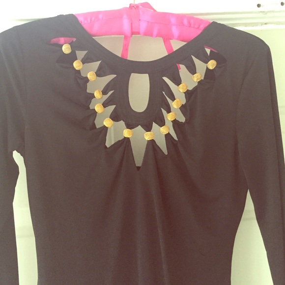 A black dress with gold details.