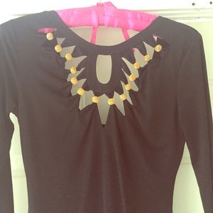 A black dress with gold details.