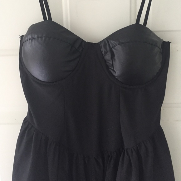Black dress with leather details.