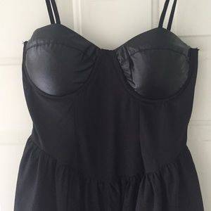 Black dress with leather details.