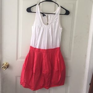 A white and coral mini dress with bubble skirt.