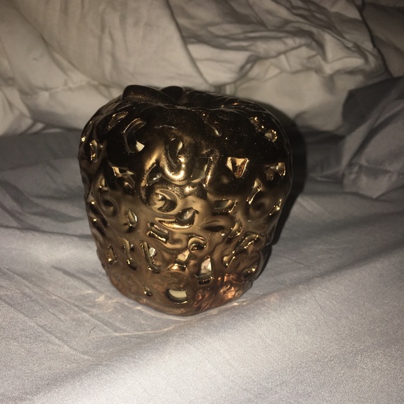 Golden metal Apple with smell good rocks inside.