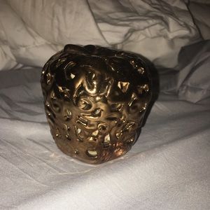 Golden metal Apple with smell good rocks inside.