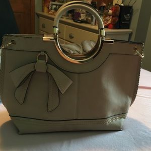 Khaki colored purse with gold trim