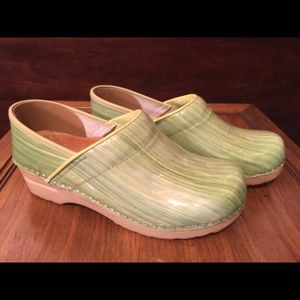 Dansko lime green patent leather clogs.
