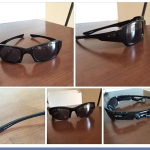 two pairs of Oakley sunglasses