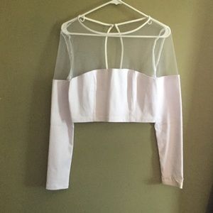 Long sleeve shirt. Sheer top, opaque bottom.