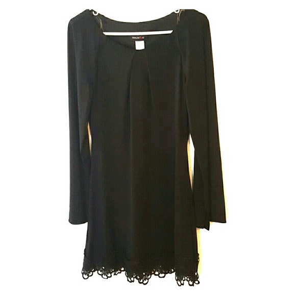 Classic black dress with sweet lace detail on hem