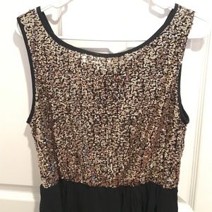 Black and gold sequined dress.