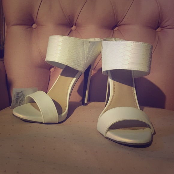 White mule style heels. Brand new!