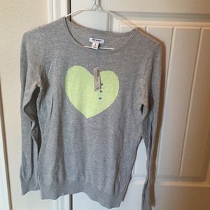 Grey sweater with yellow heart