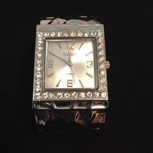 Crystal studded, silver clamp wrist watch