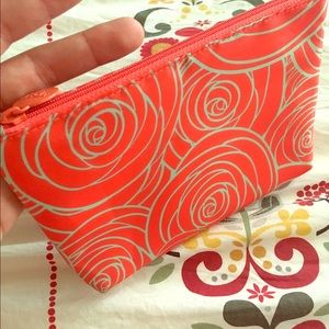 Small orange bag or makeup bag