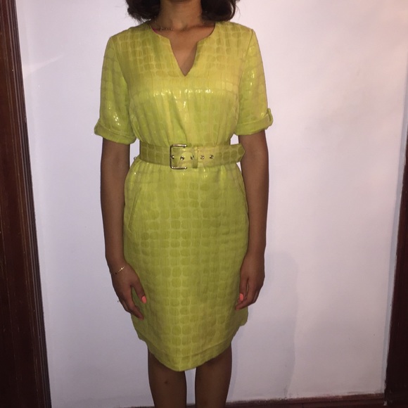 Green dress with detailed shiny circle pattern.