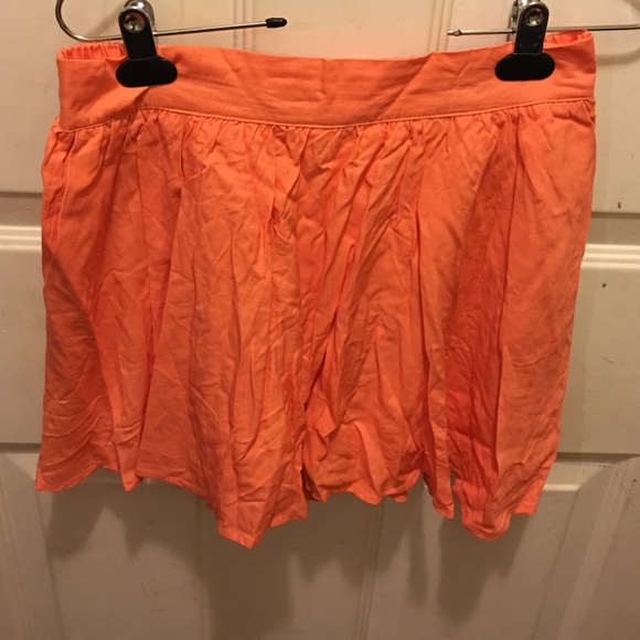 It's a skort.  It is more of a coral color.