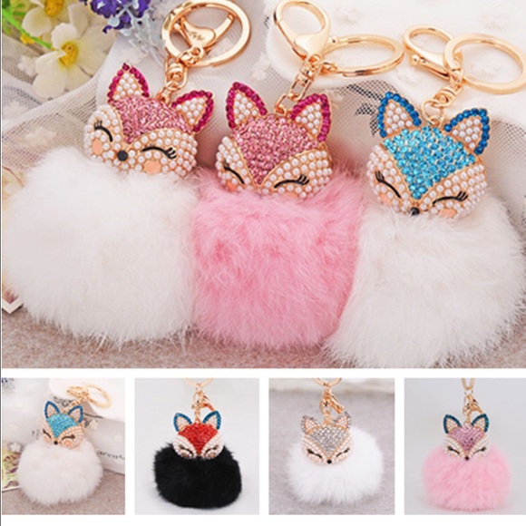 A hand full fox keychain, black