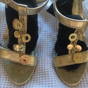 sassy gold kitten heels w/ gold coin-like detail.