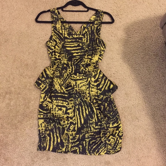 Gold and black dress, back cutout. Skirt detail.