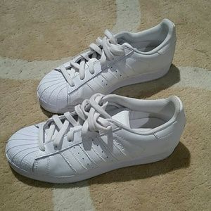 White Adidas Superstars
