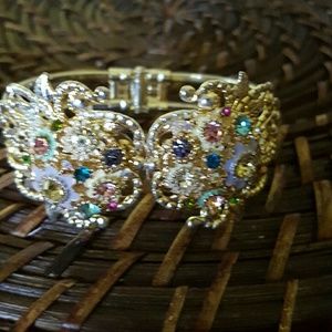 , metal filigree in rhinestone bracelet