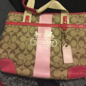 Coach tan/pink logo purse in great condition