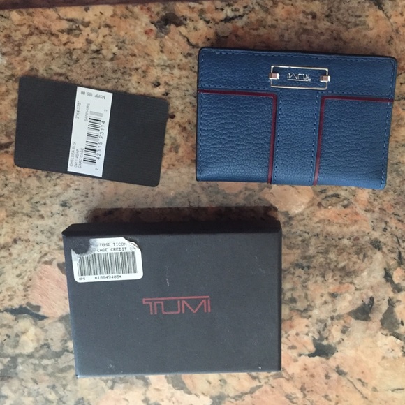 Tumi card holder.  Barely used with original tags