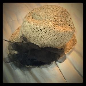 Straw hat with black flower